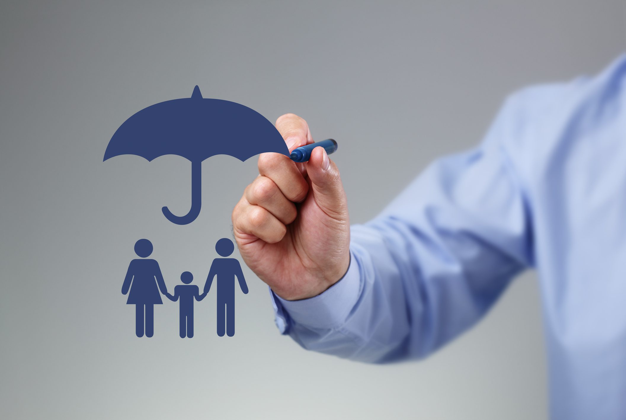 Insurance concept with hand and umbrella