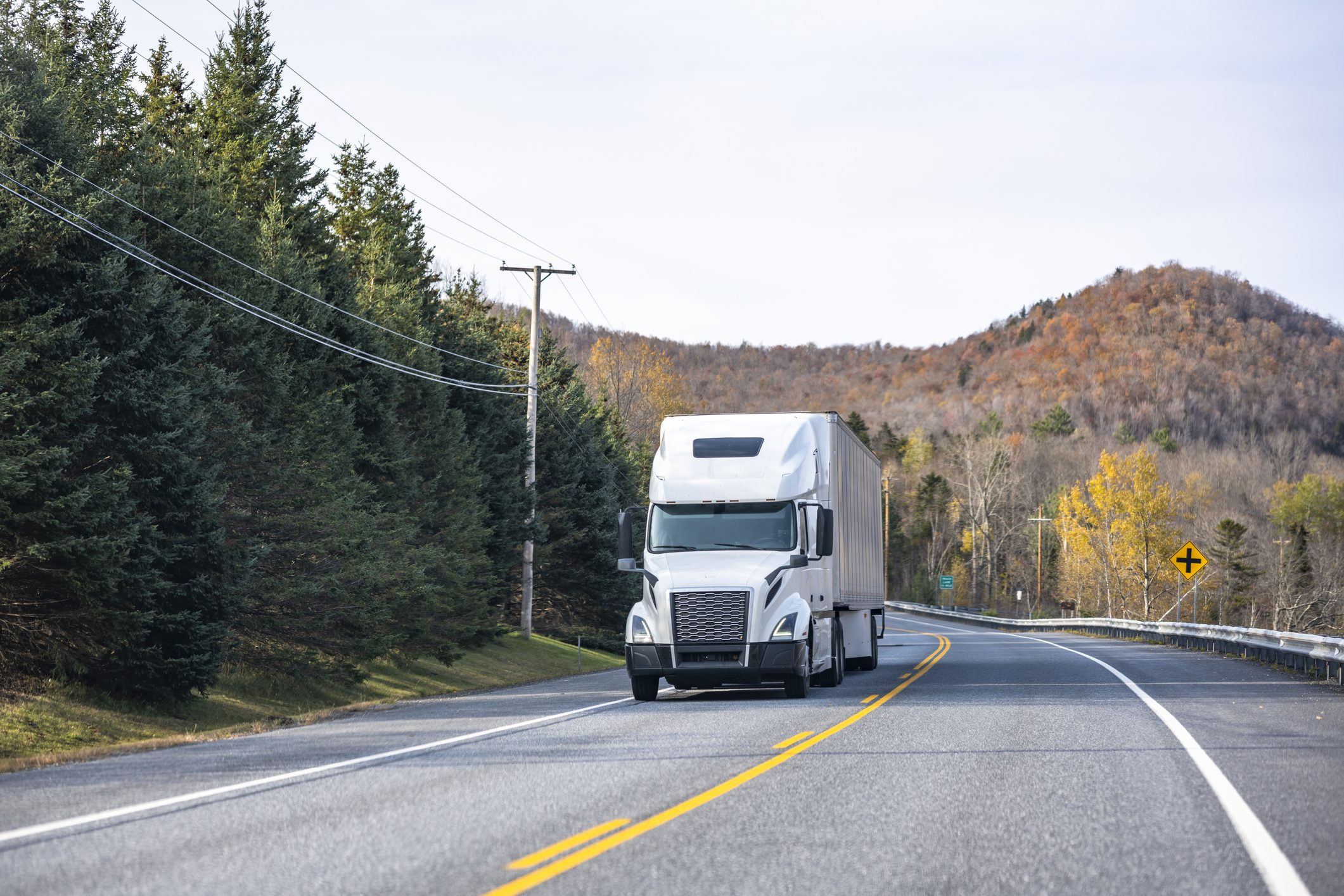 White truck traveling through countryside