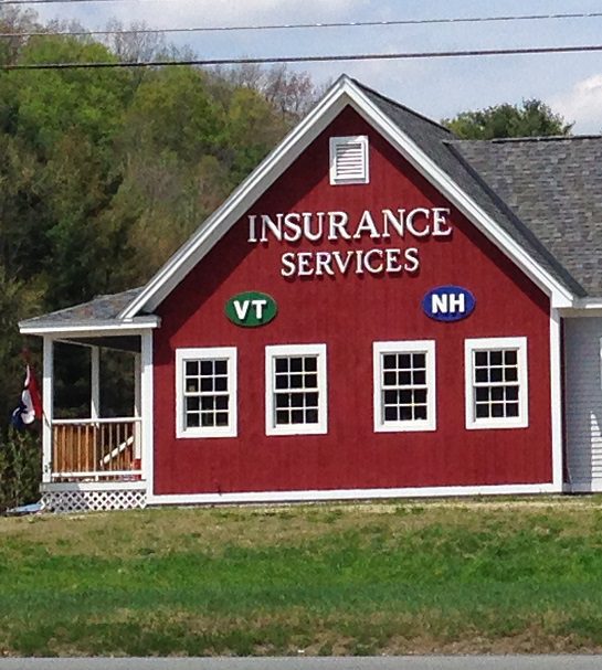 Red insurance office building with VT and NH