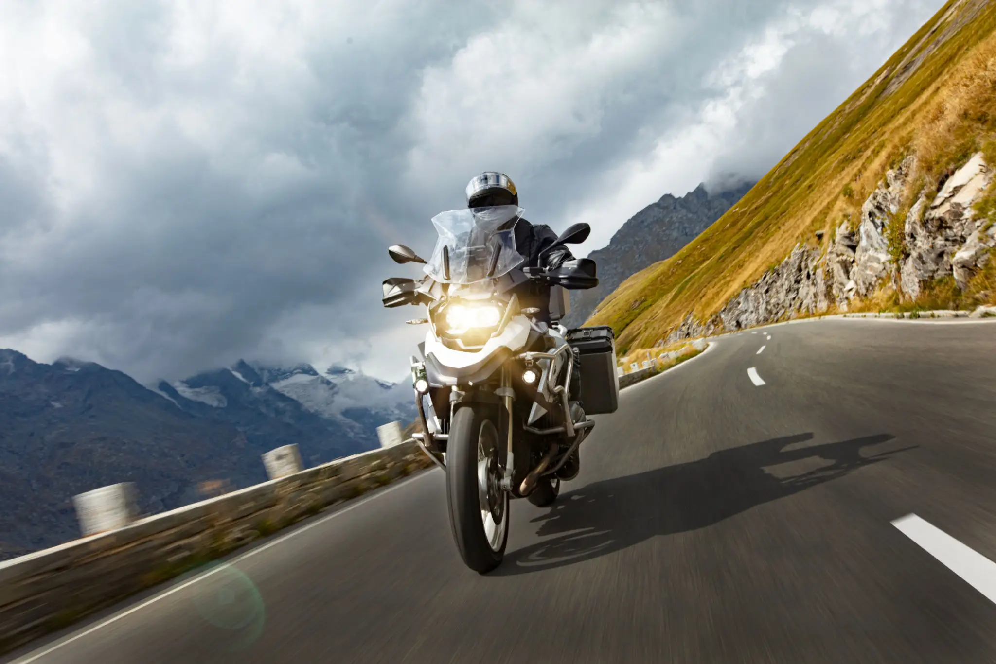 Motorcyclist riding on winding mountain road